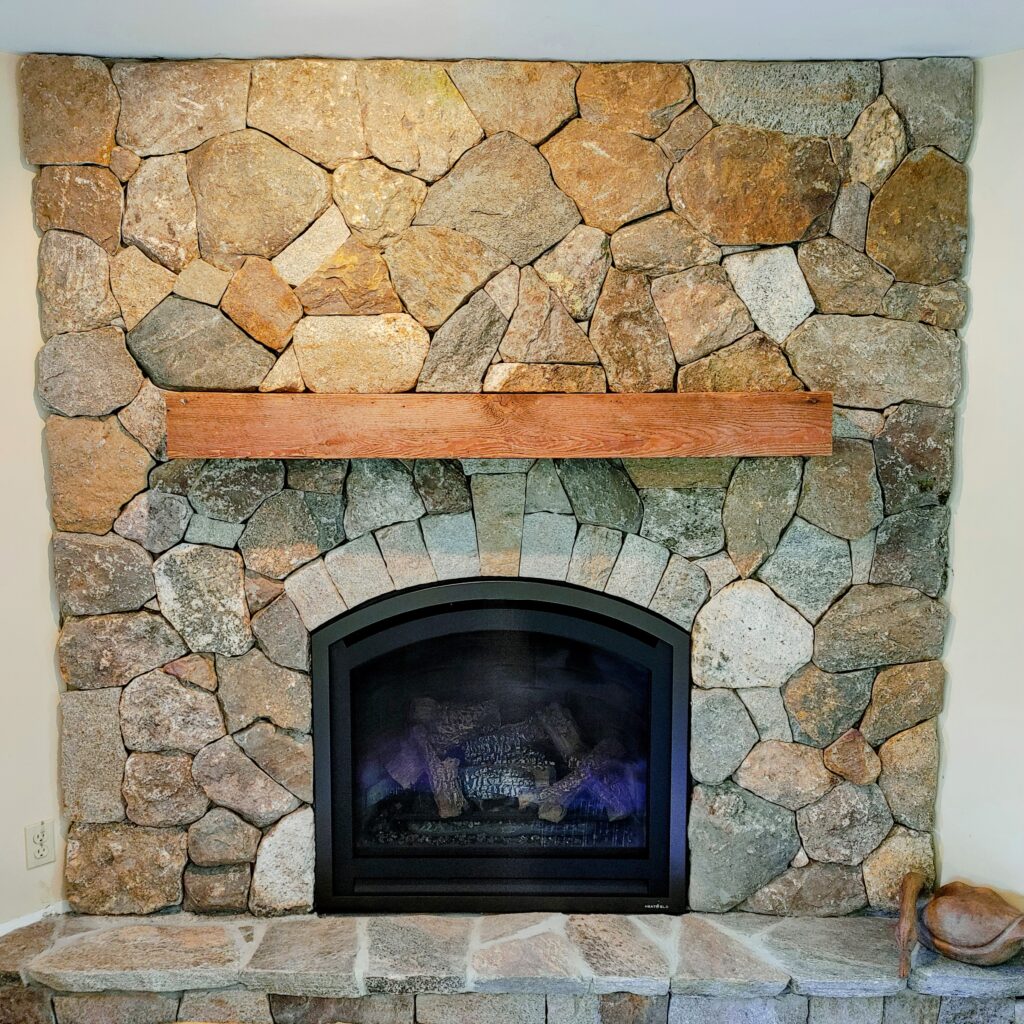 fireplace featuring multicolor New England stone veneers